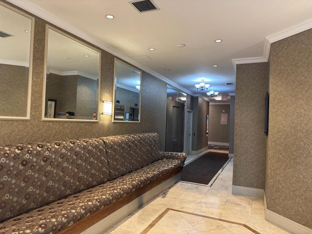 Grand Manor Condos Lobby before - Folio Interiors